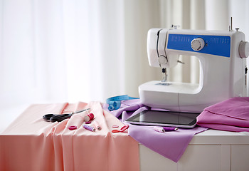 Image showing sewing machine, tablet pc, scissors and ruler