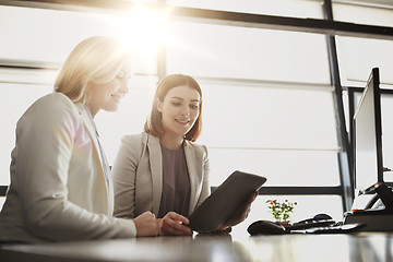 Image showing businesswomen with tablet pc computer at office