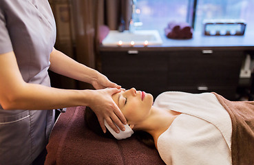 Image showing woman having face and head massage at spa parlor