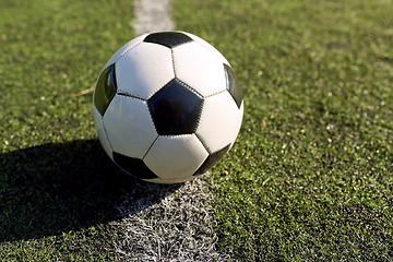 Image showing soccer ball on football field marking line