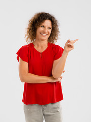 Image showing Happy woman pointing