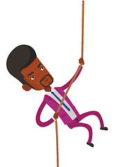 Image showing Business man climbing on the mountain.