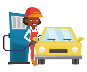 Image showing Worker filling up fuel into car.