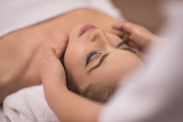 Image showing woman receiving a head massage