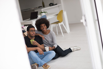 Image showing African American couple relaxing in new house