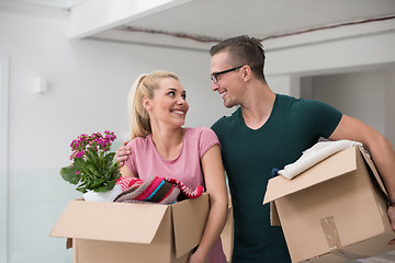 Image showing young couple moving into a new home