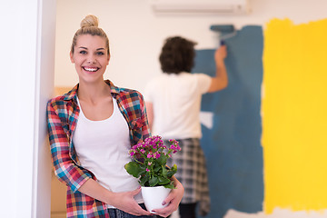 Image showing happy young couple doing home renovations