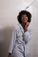 Image showing beautiful black woman wearing  bathrobe