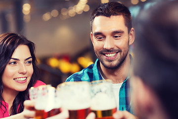 Image showing friends dining and drinking beer at restaurant