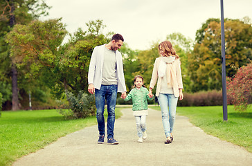 Image showing happy family walking in summer park