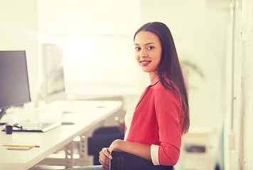 Image showing happy african woman with computer at office