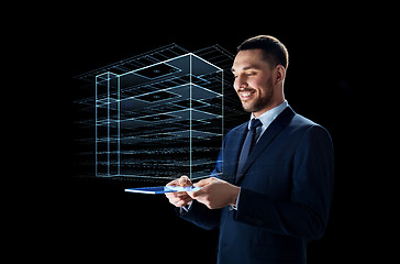 Image showing businessman with tablet pc and virtual building