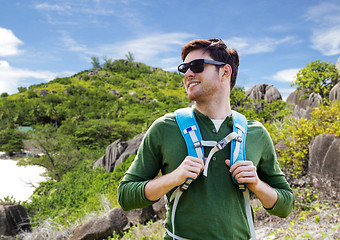 Image showing happy man with backpack traveling around island