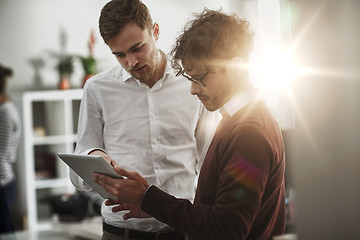 Image showing close up of business team with tablet pc at office