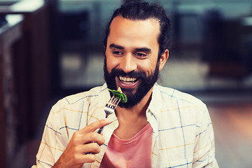 Image showing happy man having dinner at restaurant