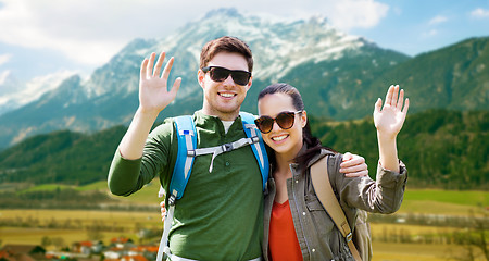 Image showing happy couple with backpacks traveling in highlands