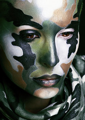 Image showing Beautiful young fashion woman with military style clothing and face paint make-up, khaki colored