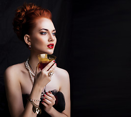 Image showing beauty stylish redhead woman with hairstyle wearing jewelry