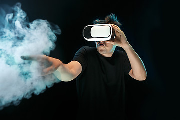 Image showing The man with glasses of virtual reality. Future technology concept.