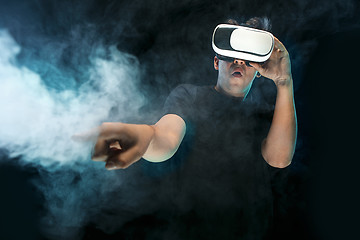 Image showing The man with glasses of virtual reality. Future technology concept.