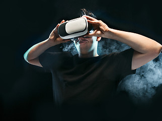 Image showing The man with glasses of virtual reality. Future technology concept.