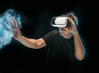 Image showing The man with glasses of virtual reality. Future technology concept.