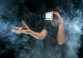 Image showing The man with glasses of virtual reality. Future technology concept.