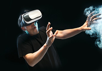 Image showing The man with glasses of virtual reality. Future technology concept.