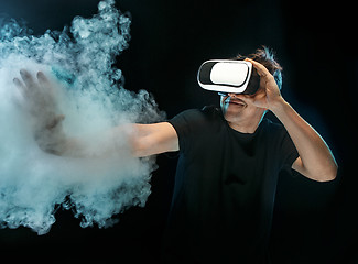 Image showing The man with glasses of virtual reality. Future technology concept.