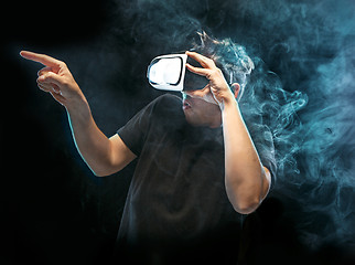 Image showing The man with glasses of virtual reality. Future technology concept.