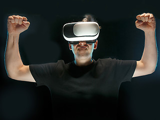 Image showing The man with glasses of virtual reality. Future technology concept.