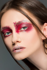 Image showing Beautiful woman face portrait close up with red make up