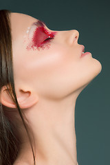 Image showing Beautiful woman face portrait close up with red make up