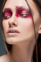 Image showing Beautiful woman face portrait close up with red make up