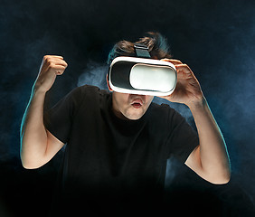 Image showing The man with glasses of virtual reality. Future technology concept.