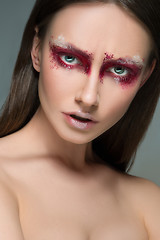 Image showing Beautiful woman face portrait close up with red make up