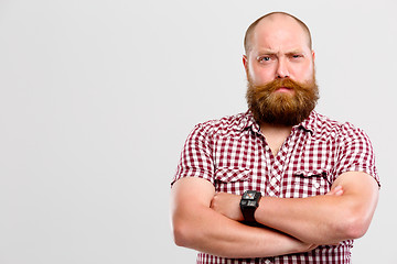 Image showing Man with screwed-up eye , beard