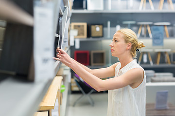 Image showing Woman shopping for furniture, sofa and home decor in store.