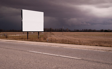 Image showing Roadside Billboard Advertising Medium Dark Stormy Skies
