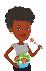 Image showing Woman eating healthy vegetable salad.