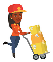 Image showing Delivery postman with cardboard boxes on trolley.