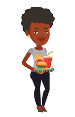 Image showing Woman holding tray full of fast food.