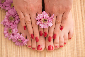 Image showing female feet and hands at spa salon