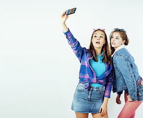 Image showing best friends teenage girls together having fun, posing emotional on white background, besties happy smiling, lifestyle people concept close up. making selfie