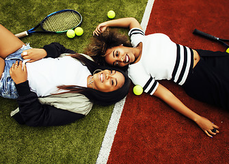 Image showing young pretty girlfriends hanging on tennis court, fashion stylis