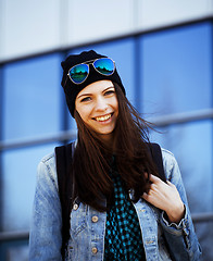 Image showing cute brunette teenage girl in hat, student outside