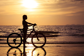 Image showing Happy teen girl  walking on the beach