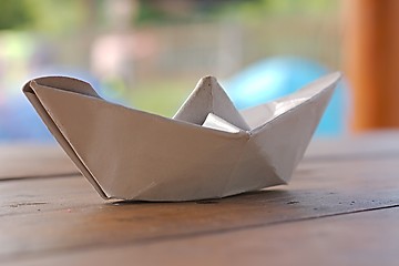 Image showing Paper boat on a table