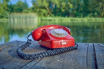 Image showing Old telephone in nature