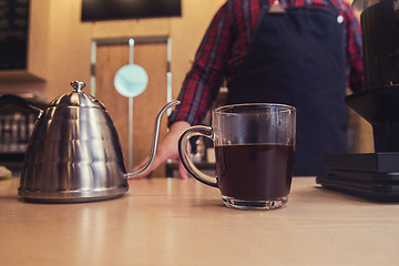 Image showing Barista brewing aeropress coffee